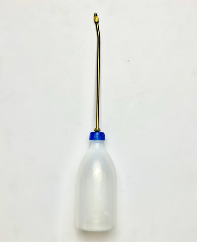 Squeezable Oil Bottle is a transparent polyethylene container used for oiling movable parts. It features an adjustable brass pointed pipe. Often used for refilling Transmission fluid in Honda vehicles that include Civic and Accord.